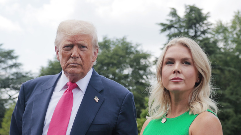 Donald Trump and Karoline Leavitt at a press conference