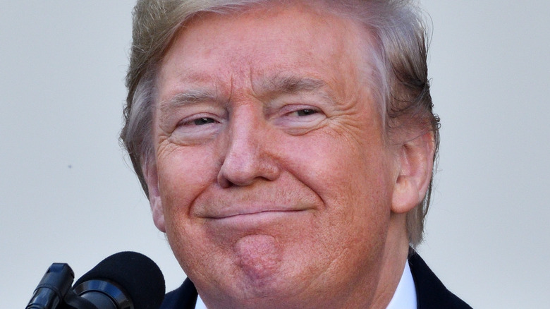 Donald Trump smirking at a event