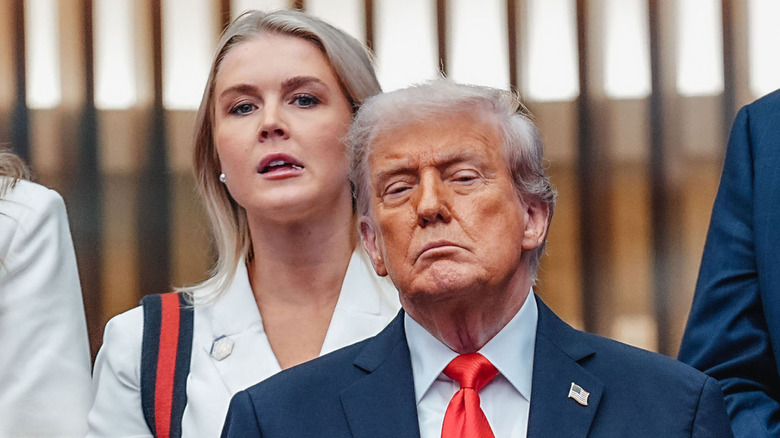 Karoline Leavitt standing behind Donald Trump during the Men's Singles Final at the 2025 US Open