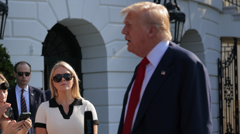 Karoline Leavitt watching Donald Trump speak