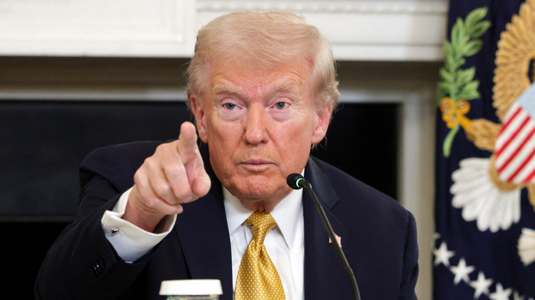 President Donald Trump taking a question from a reporter as he delivers an announcement on his Homeland Security Task Force in the State Dining Room of the White House