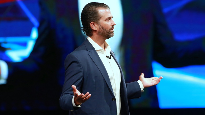 Donald Trump Jr. holding his arms out wide
