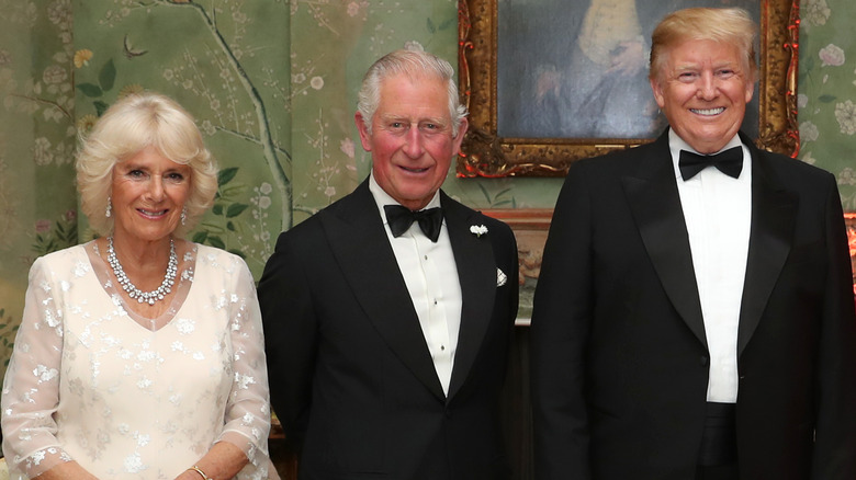 Donald Trump wears a tuxedo and beams alongside the then-Prince Charles and Camilla, Duchess of Cornwall.