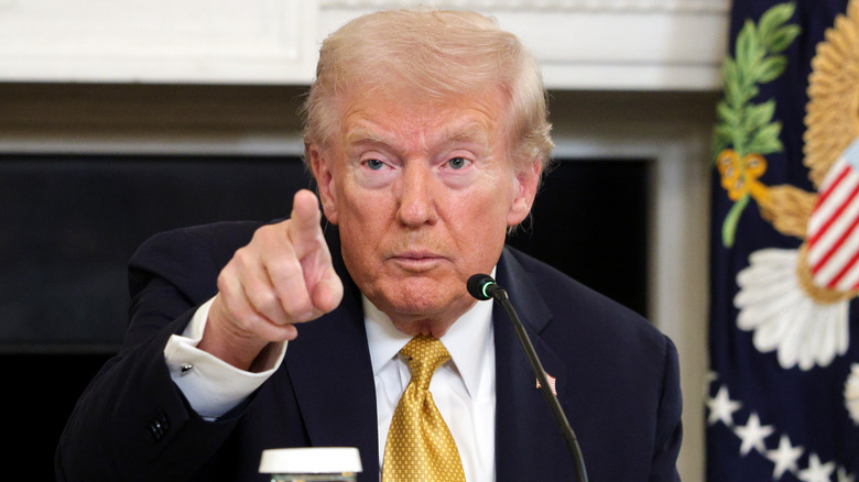 Donald Trump pointing in the Oval Office