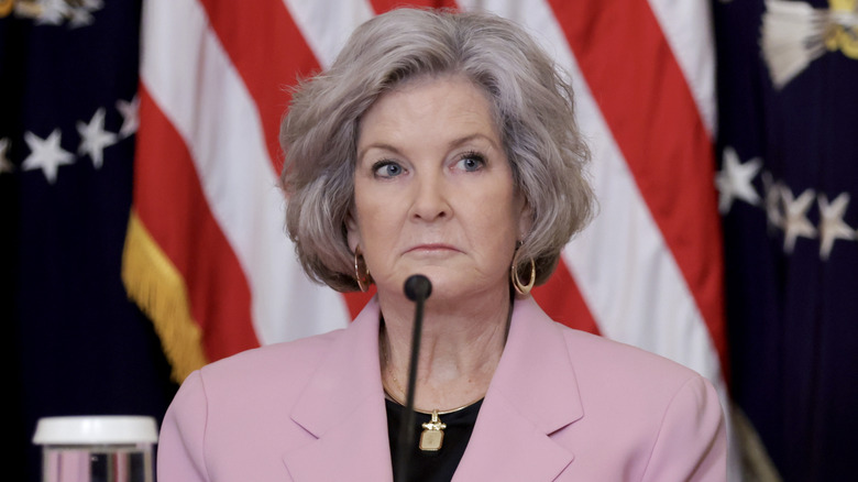 Susie Wiles standing at a podium