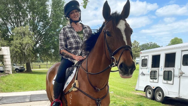 Stormy Daniels riding a horse