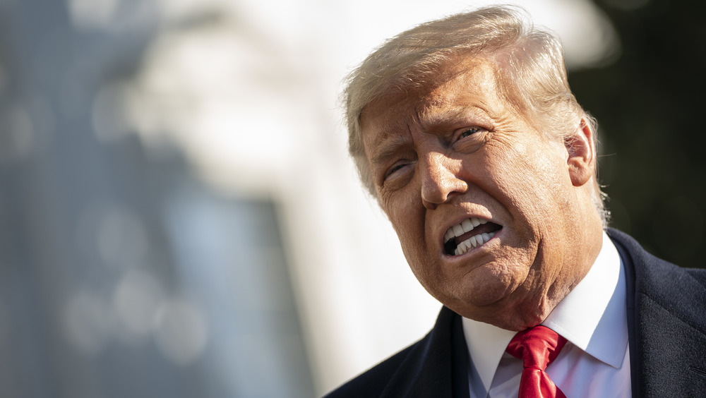 U.S. President Donald Trump looks back at journalists after welcoming Mongolian President Battulga Khaltmaa to the White House July 31, 2019