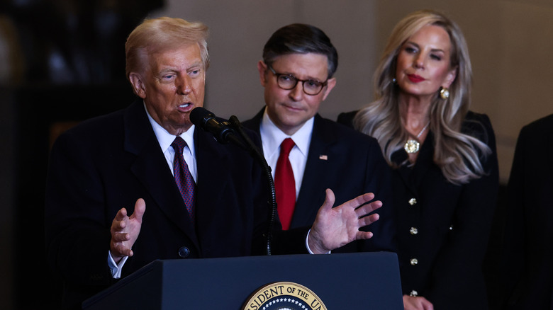 Donald Trump, alongside House Speaker Mike Johnson and wife Kelly Johnson, speaking to the crowd in the VIP overflow viewing area in Emancipation Hall after his inauguration at the U.S. Capitol