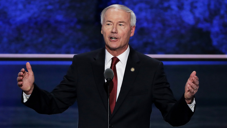 Asa Hutchinson speaking into microphone 