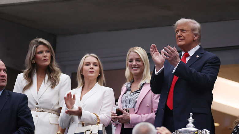 Donald Trump seen with his aides at the US Open