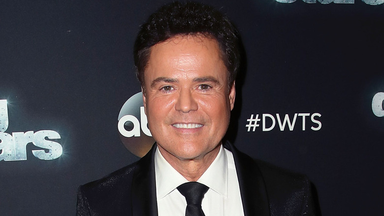 Donny Osmond poses on the red carpet 