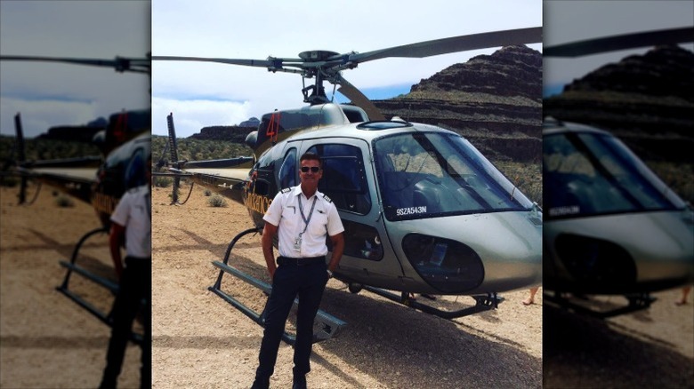 Lorenzo Lamas poses in front of helicopter in 2016