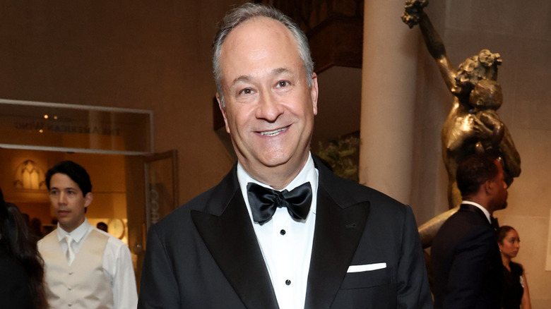 Doug Emhoff smiling in a tuxedo