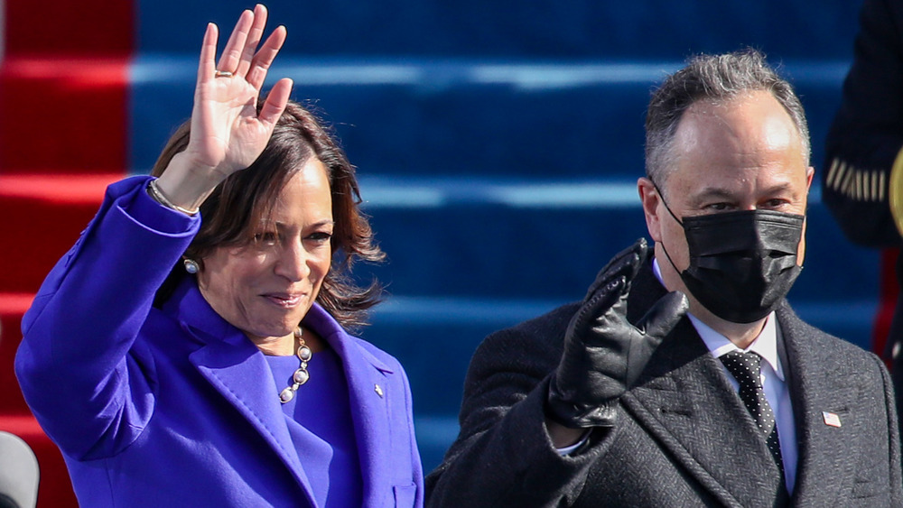 Kamala Harris and Doug Emhoff waving at the inauguration 