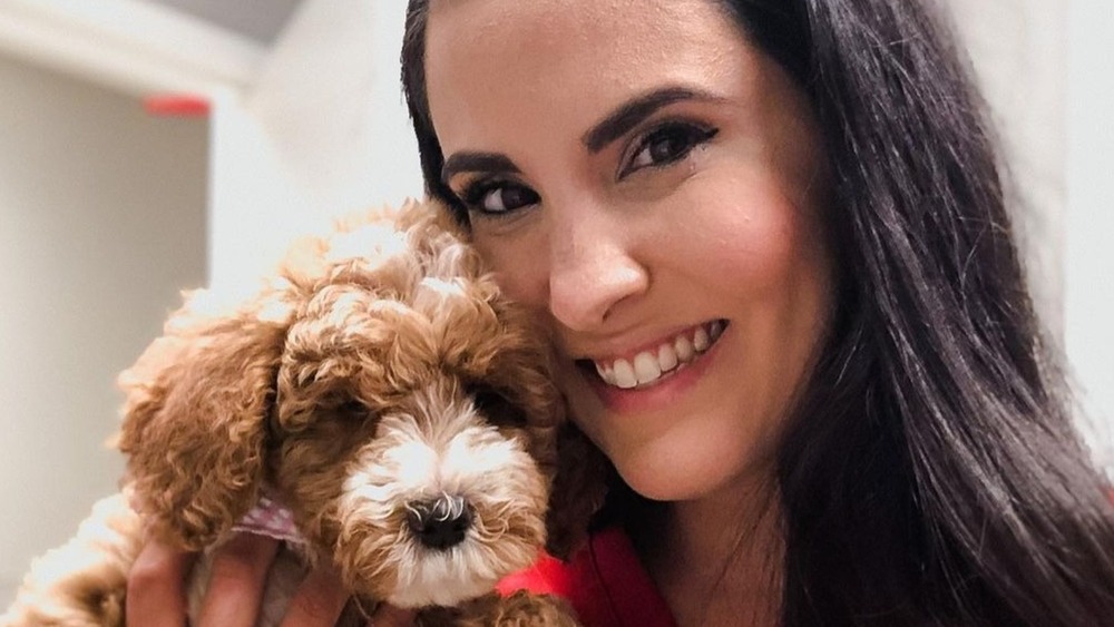 Dr. Jackie Duenas holding a dog