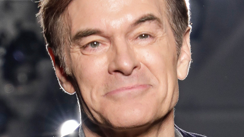 Dr. Mehmet Oz slight grin