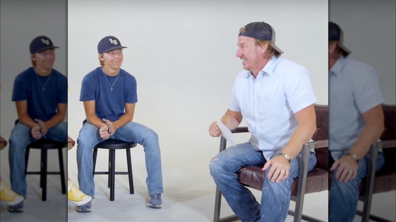 Drake Gaines sitting across from Chip Gaines