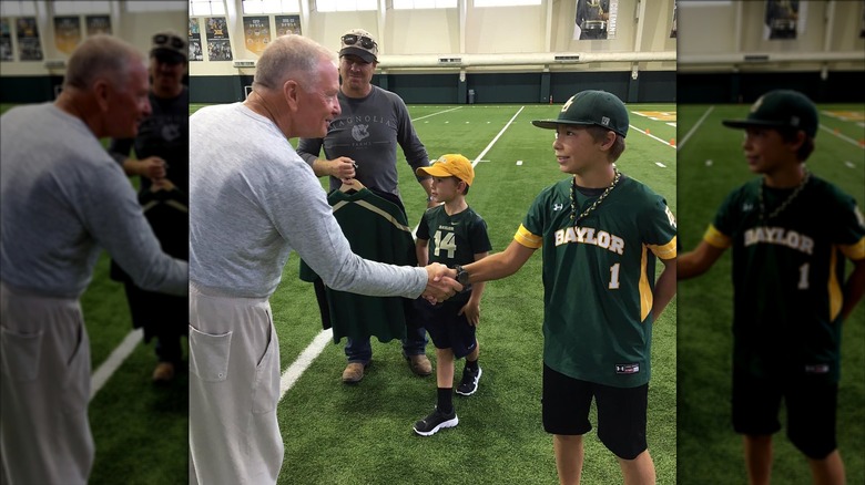 Drake Gaines shaking hands with Baylor University's former head coach