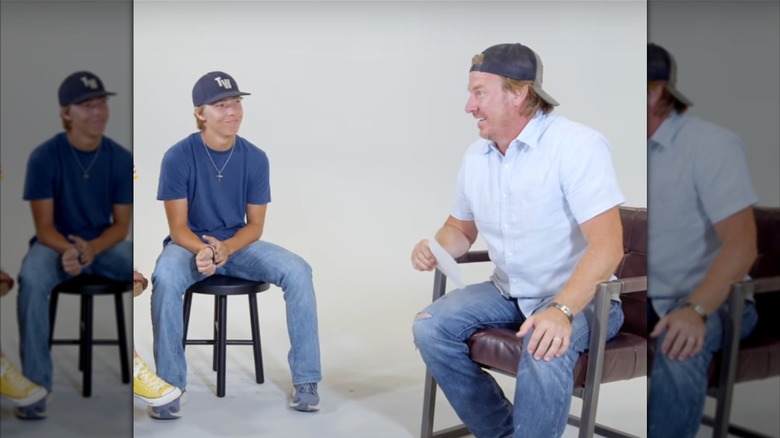 Drake Gaines sitting across from Chip Gaines