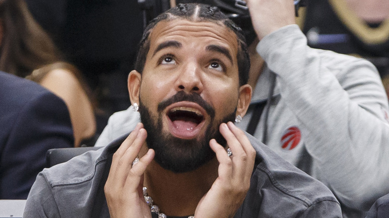 Drake looking up in surprise