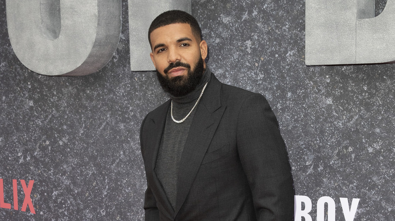 Drake smiling at red carpet event