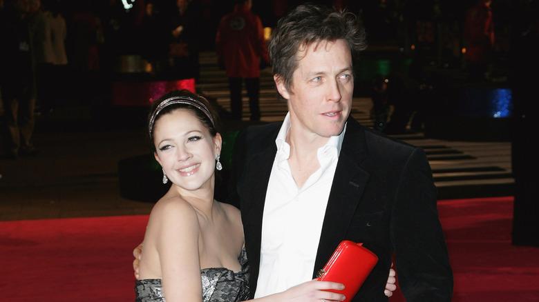 Drew Barrymore hugging Hugh Grant