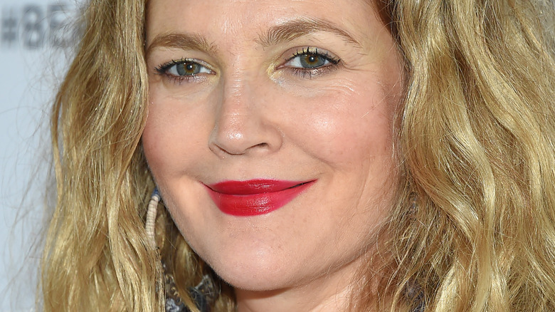 Drew Barrymore smiling on the red carpet 