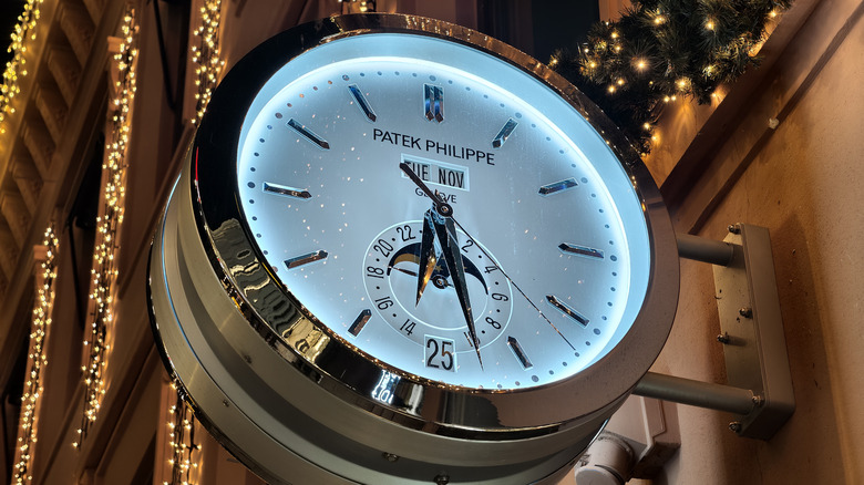 Patek Philippe clock store sign with Christmas lights.