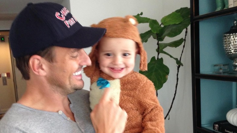 Bill Rancic  holding baby Duke.