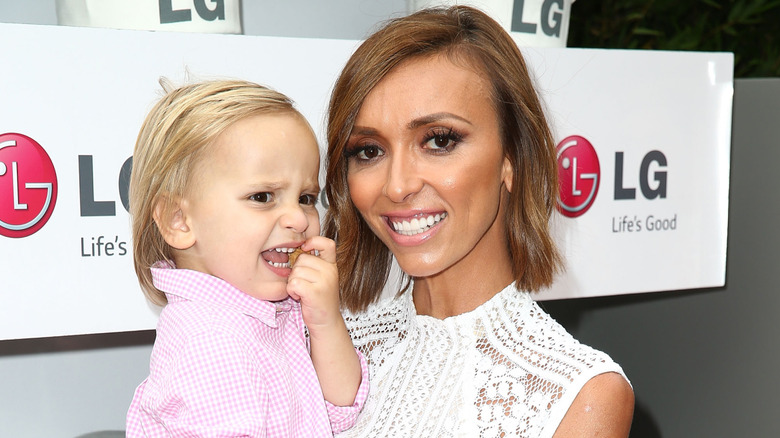 Duke and his mom on a 2014 red carpet.