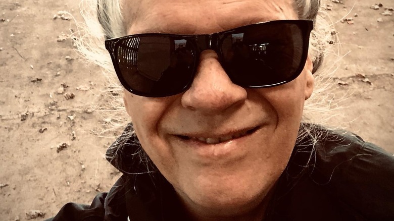 Andy Taylor smiling with sunglasses