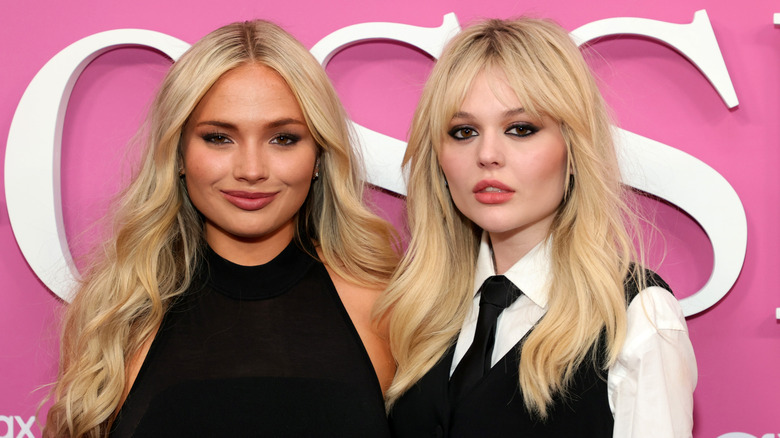 Natalie Alyn Lind and Emily Alyn Lind posing together at an event
