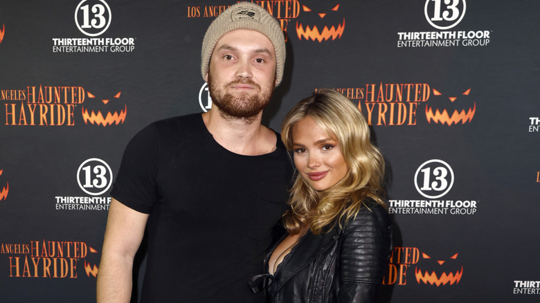 Natalie Alyn Lind and Kai Caster embracing