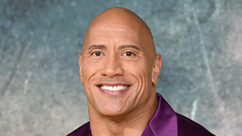 Dwayne Johnson posing with a big smile