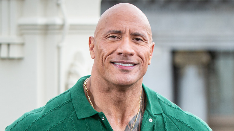 Dwayne Johnson posing for photo on red carpet 