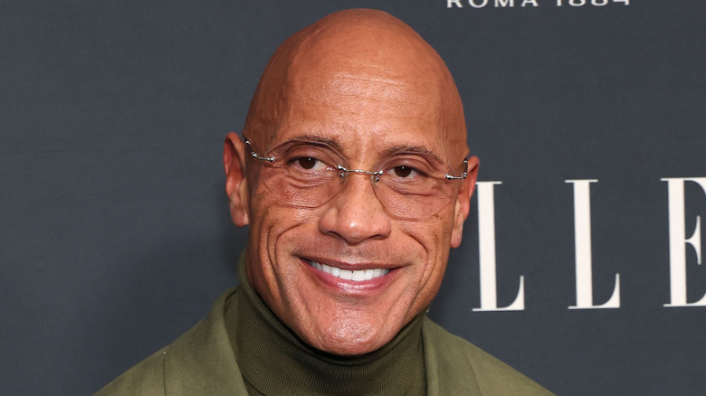 Dwayne Johnson posing in all green