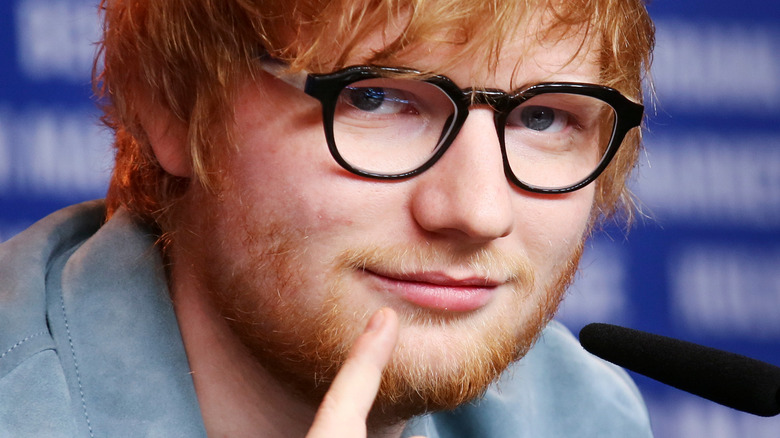 Ed Sheehan pointing to face