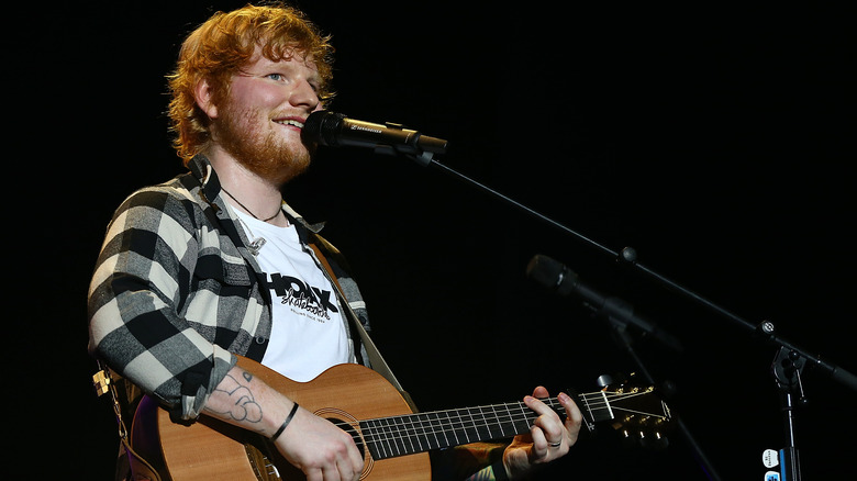 Ed Sheeran performing on stage