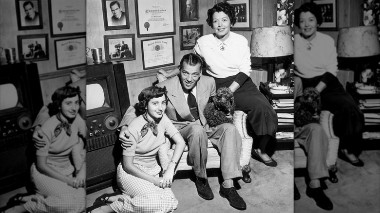 Ed Sullivan posing with his wife Sylvia, daughter Betty, and their poodle.