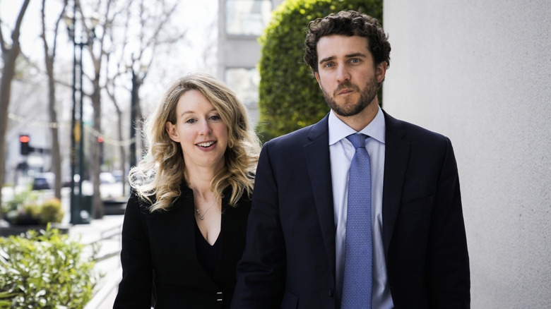 Elizabeth Holmes and Billy Evans walking outdoors