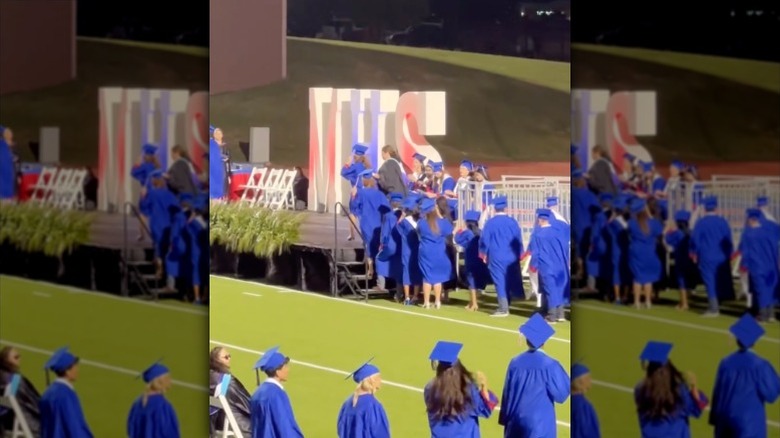 Ella Gaines walks across the stage on her high school graduation