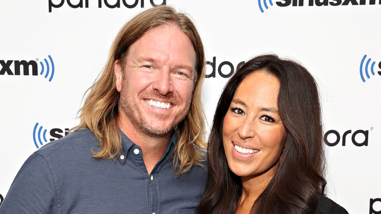 Chip and Joanna Gaines pose in 2021