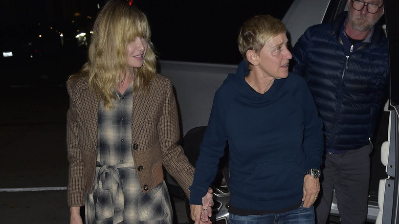 Portia De Rossi and Ellen Degeneres walking hand in hand