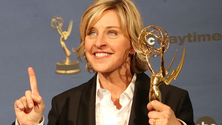 Ellen DeGeneres smiling with a Daytime Emmy award