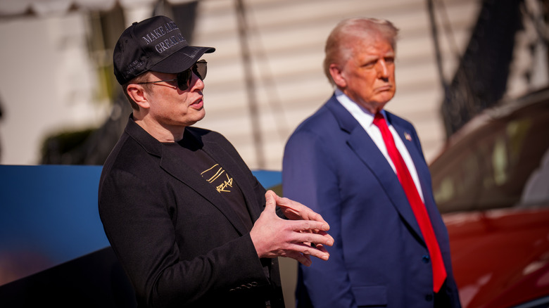 Elon Musk and Donald Trump standing outside the White House