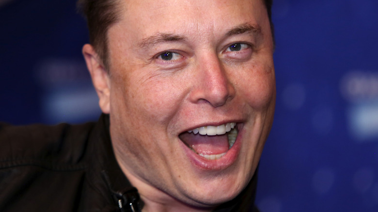 Elon Musk mouth open laughing
