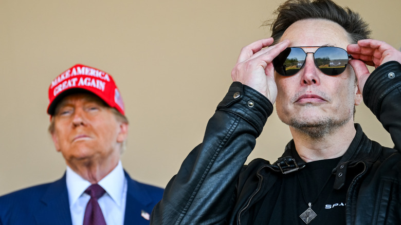Donald Trump wearing MAGA hat and Elon Musk wearing sunglasses