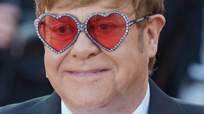 Elton John wearing heart-shaped glasses