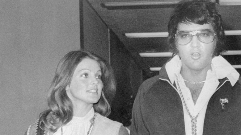 Elvis and Priscilla Presley leave the courthouse after finalizing their divorce in 1973
