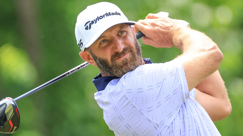 Dustin Johnson swinging golf club